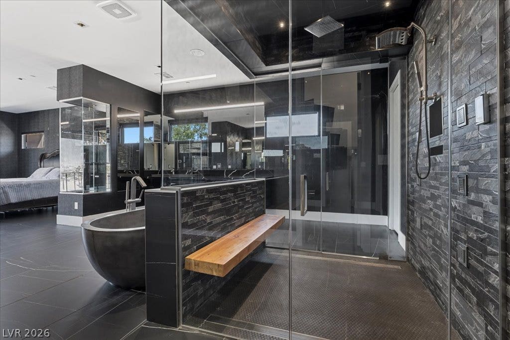2839 Edgemont Drive, Henderson, NV 89074 Indulge in this luxurious primary bathroom with a spacious walk-in shower and freestanding tub.