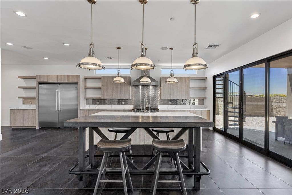 2839 Edgemont Drive, Henderson, NV 89074 Culinary aspirations meet contemporary design in this generously appointed kitchen, featuring a spacious island for entertaining.