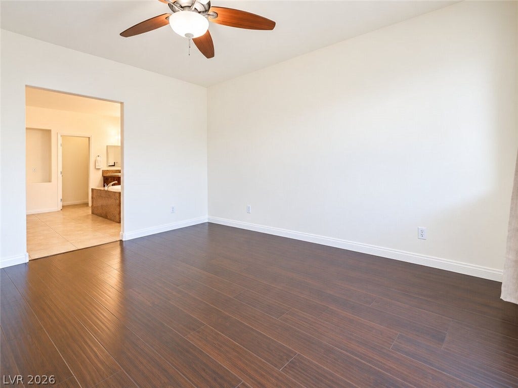 669 Doubleshot Lane, Henderson, NV 89052 Gleaming hardwood floors and a spacious layout define this comfortable bedroom suite.