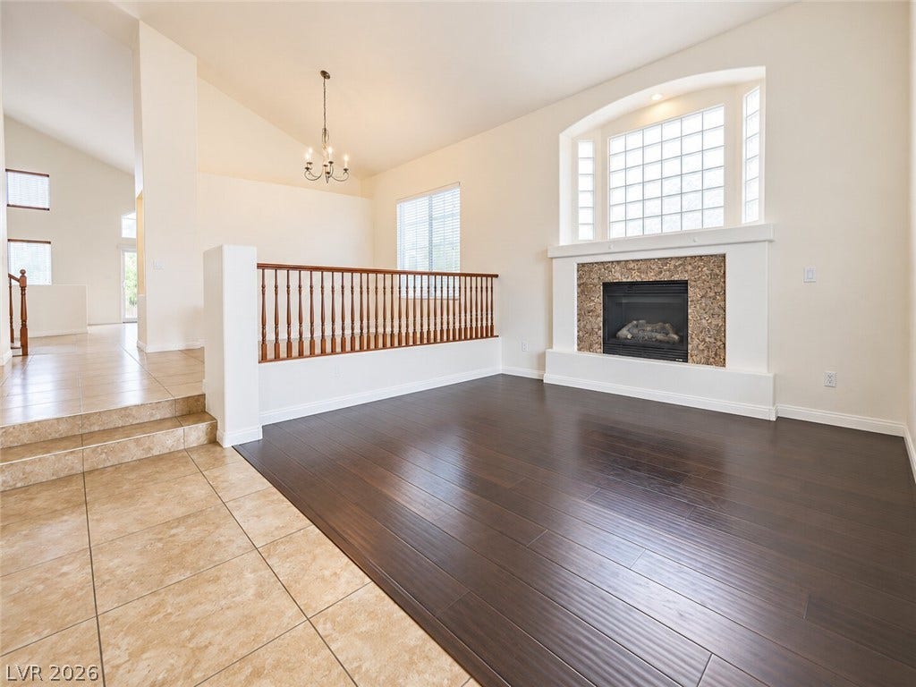 669 Doubleshot Lane, Henderson, NV 89052 Gleaming hardwood floors and a stone fireplace anchor this inviting living space.