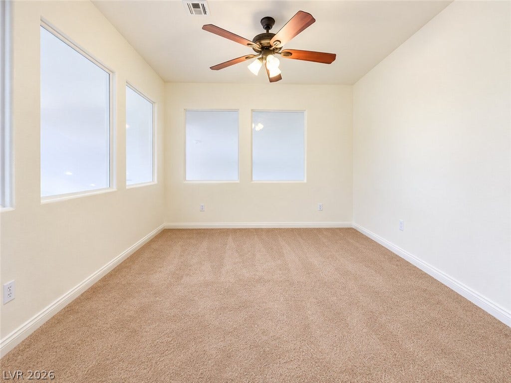 669 Doubleshot Lane, Henderson, NV 89052 Generous windows illuminate this versatile room featuring soft carpeting and high ceilings.