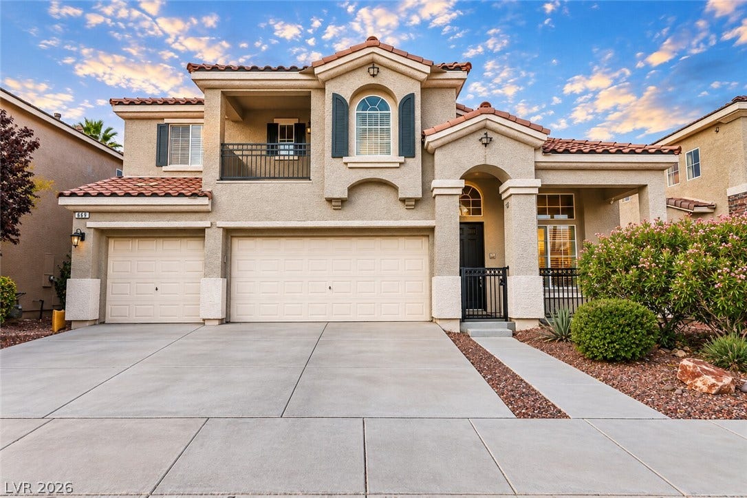 669 Doubleshot Lane, Henderson, NV 89052 Spanish tile roofing and classic stucco exterior elements define this inviting multi-level residence.