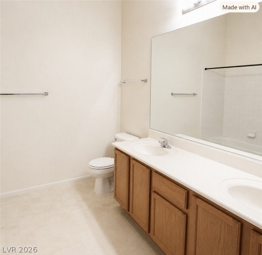 2305 W Horizon Ridge Parkway, #4024, Henderson, NV 89052 A spacious double vanity and neutral flooring anchor this classic, functional bathroom space.