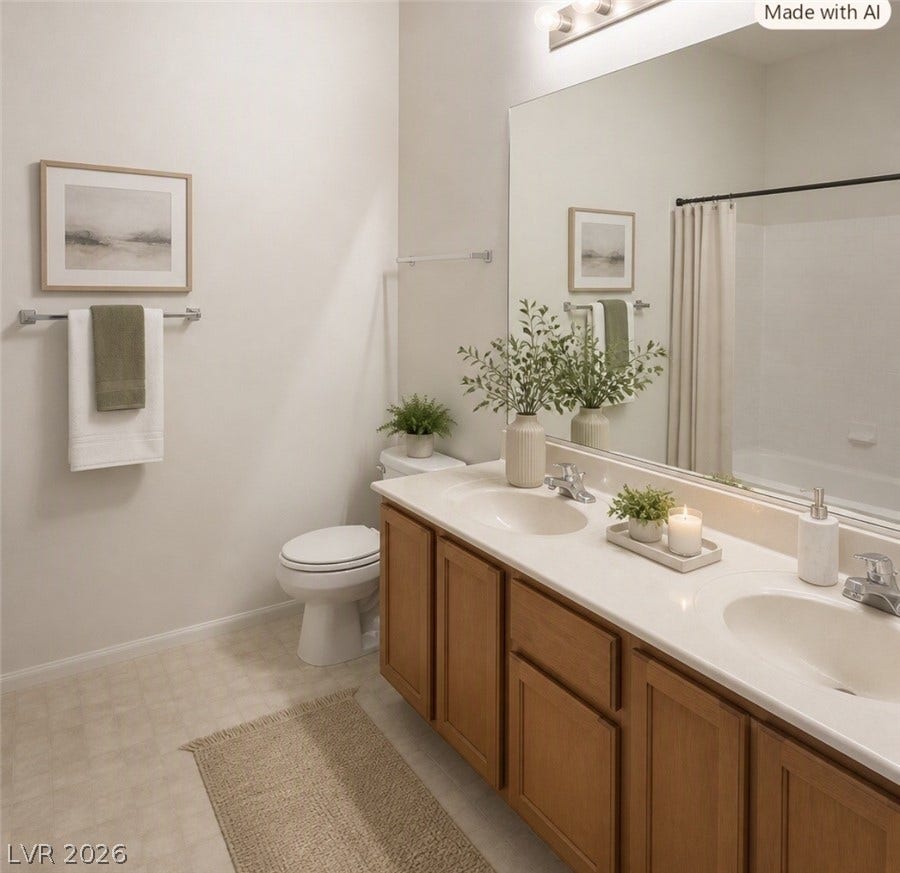 2305 W Horizon Ridge Parkway, #4024, Henderson, NV 89052 Double vanity sinks and clean neutral tones define this well-appointed bathroom space.