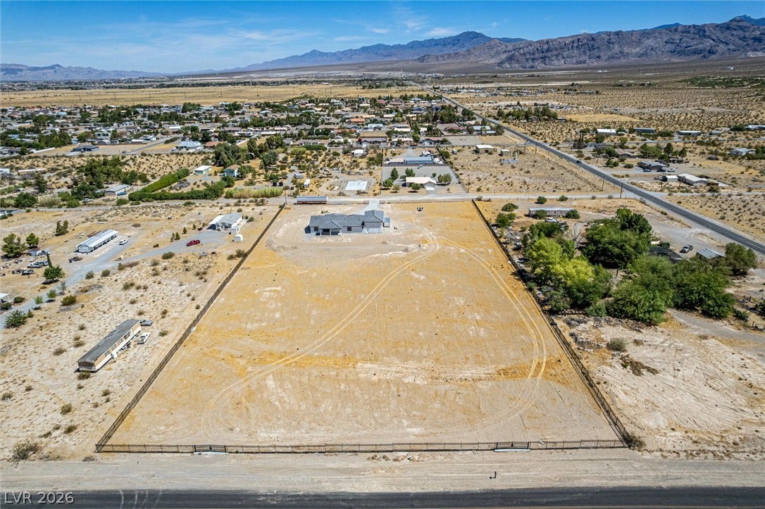 5910 E Kellogg Road, Pahrump, NV 89061 Sweeping desert and mountain views frame this vast, fully fenced acreage.