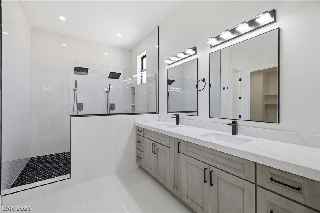 5910 E Kellogg Road, Pahrump, NV 89061 Clean lines and a spacious dual vanity define this modern master bath layout.