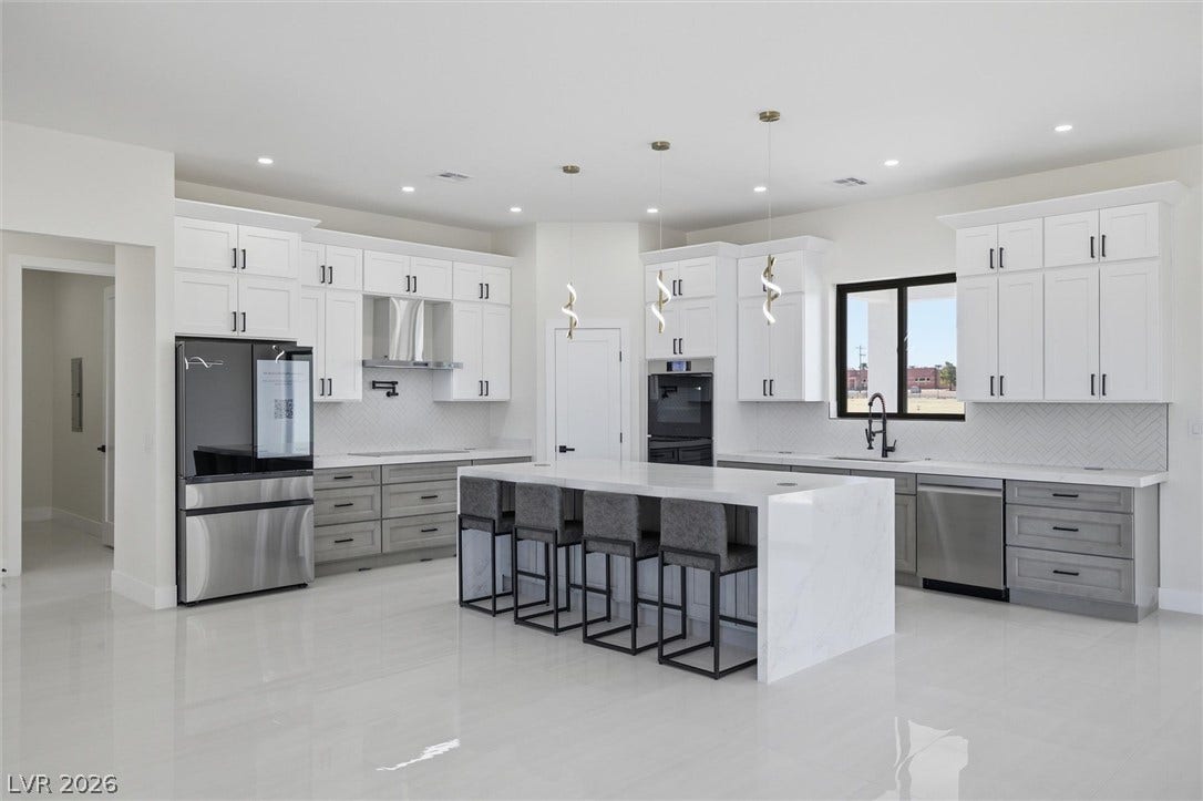 5910 E Kellogg Road, Pahrump, NV 89061 Polished tile flooring and minimalist cabinetry define this contemporary culinary space.