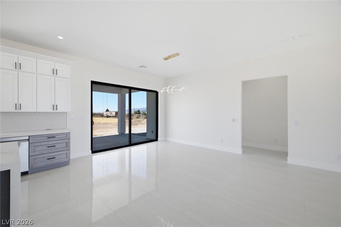5910 E Kellogg Road, Pahrump, NV 89061 Gleaming polished tile floors reflect light throughout this open and airy living area.