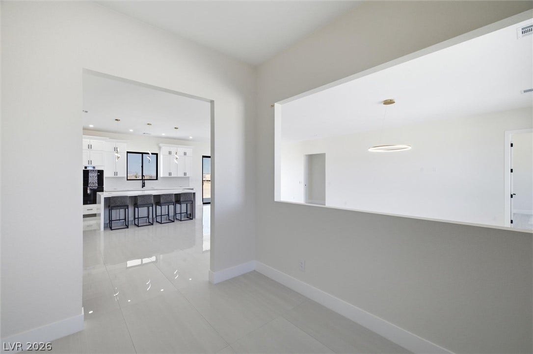 5910 E Kellogg Road, Pahrump, NV 89061 Gleaming tile floors and wide interior cutouts create a seamless flow between rooms.
