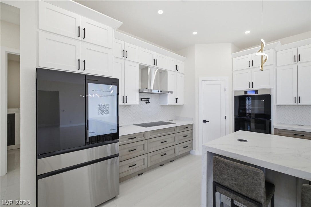 5910 E Kellogg Road, Pahrump, NV 89061 Sleek contemporary cabinetry meets premium appliances in this beautifully crafted culinary space.