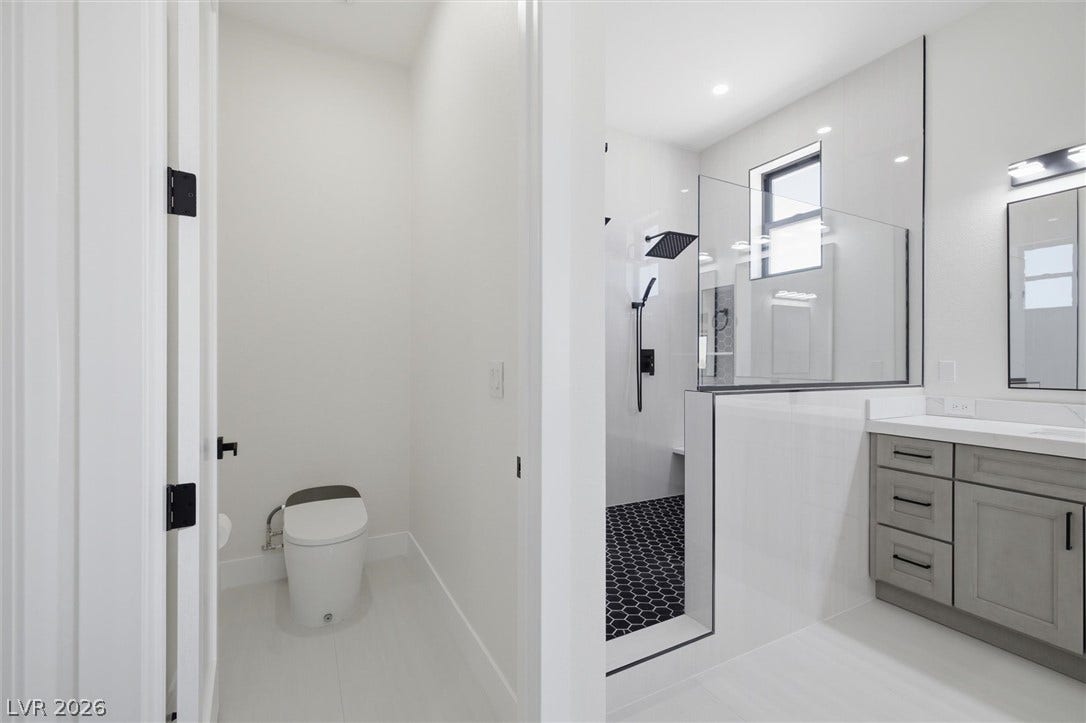 5910 E Kellogg Road, Pahrump, NV 89061 Clean lines and modern tile work define this sleek master bathroom retreat.
