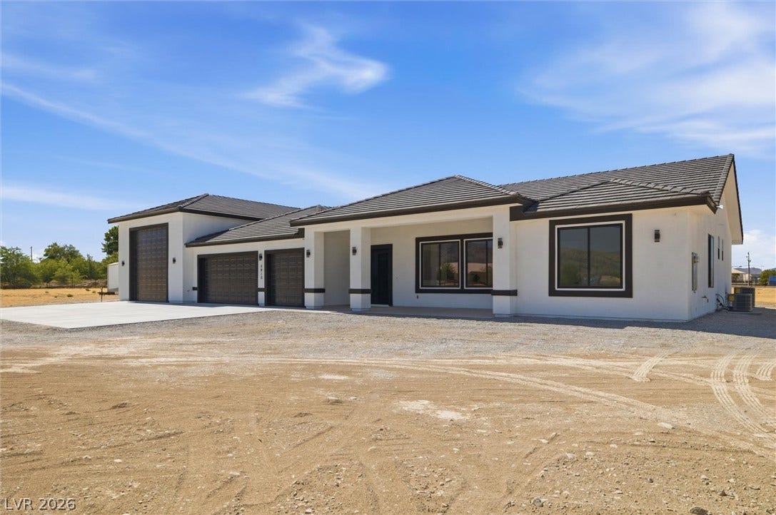 5910 E Kellogg Road, Pahrump, NV 89061 Clean lines and a sprawling tile roof define this modern single-story desert home.
