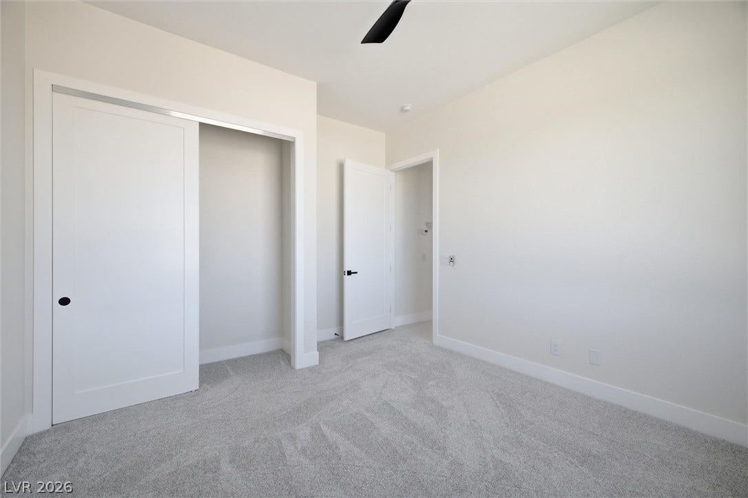 5910 E Kellogg Road, Pahrump, NV 89061 Soft carpeting underfoot and high ceilings define this versatile secondary bedroom space.