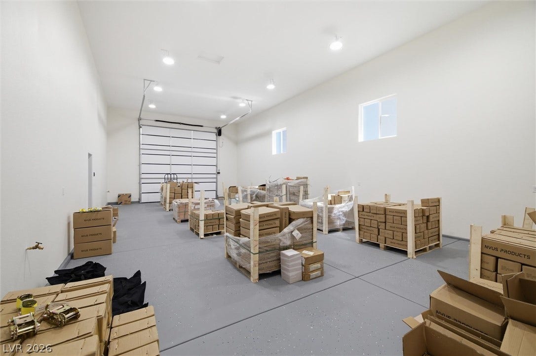 5910 E Kellogg Road, Pahrump, NV 89061 A spacious workshop space boasts high ceilings and durable epoxy-coated concrete flooring.