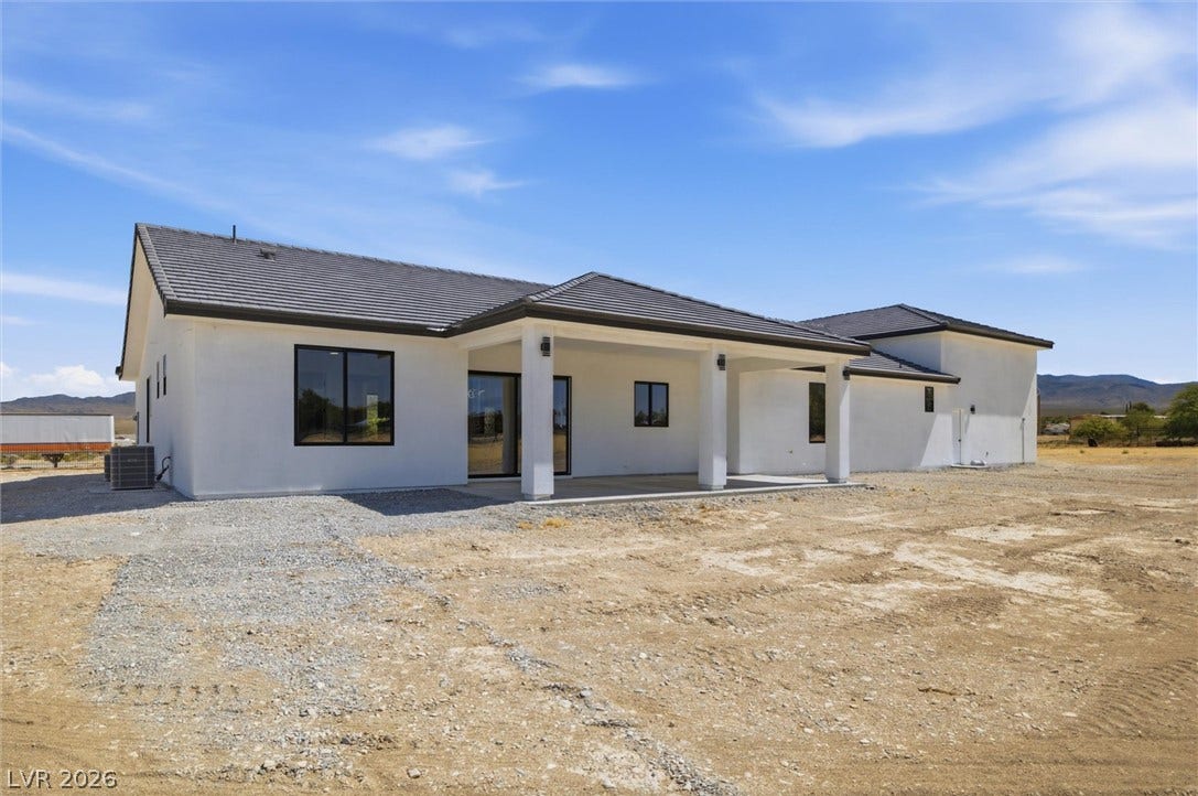 5910 E Kellogg Road, Pahrump, NV 89061 A spacious covered patio anchors the rear of this contemporary stucco home.