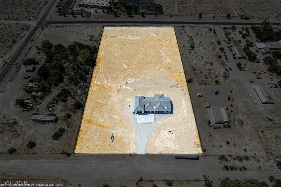 5910 E Kellogg Road, Pahrump, NV 89061 An expansive acreage property offers endless possibilities for development and custom landscaping.