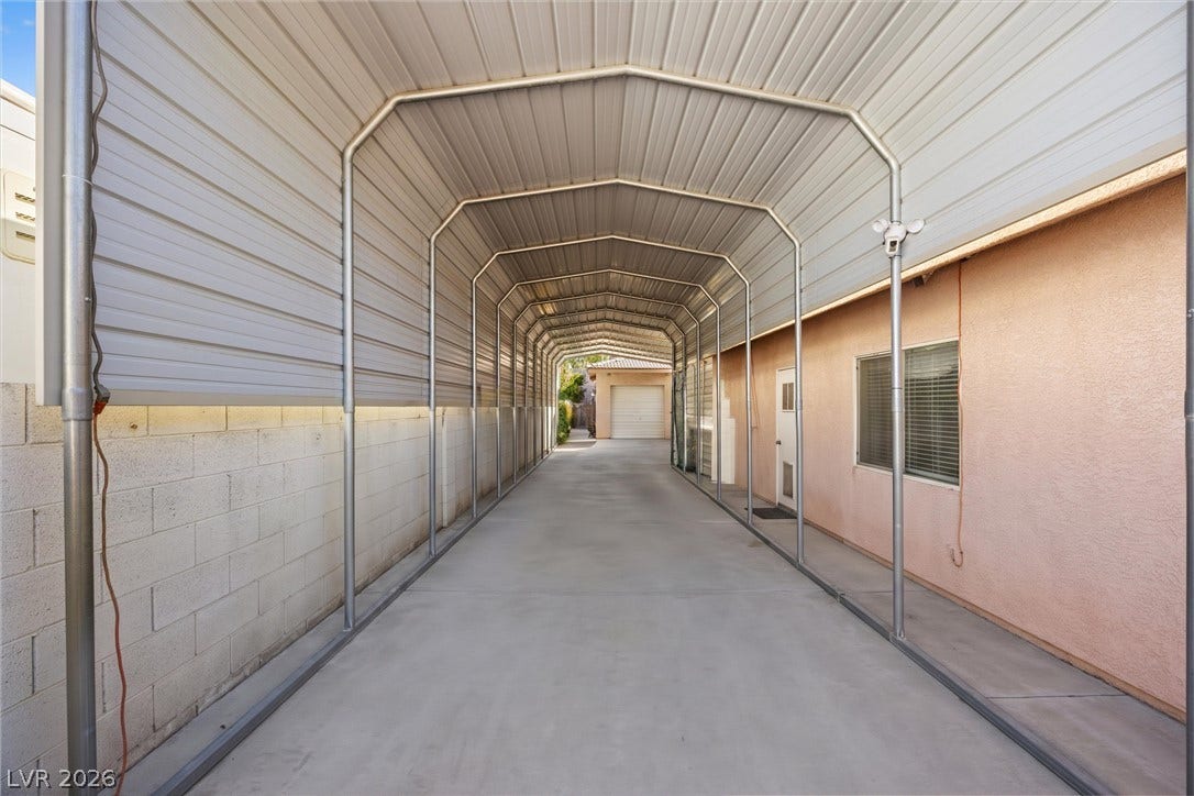 211 W Highland Drive, Henderson, NV 89015 RV coverage. AI generated to remove exsting RV's.Drain out and hook ups.