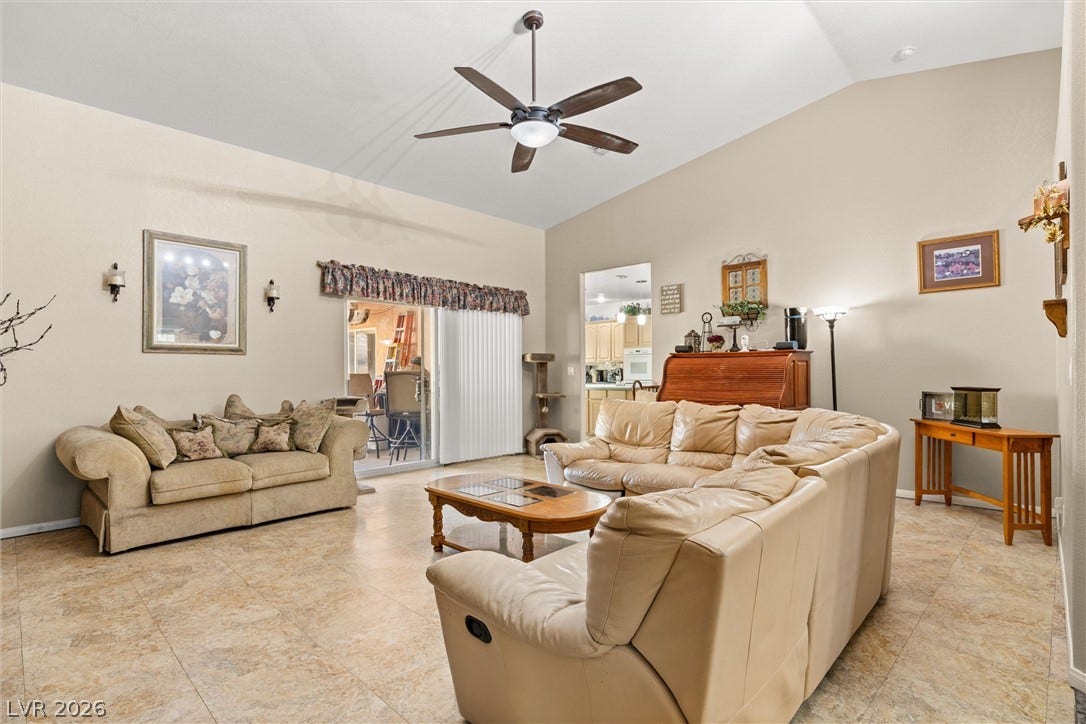211 W Highland Drive, Henderson, NV 89015 Lrg lving room has sliding glass door to the covered patiro area.