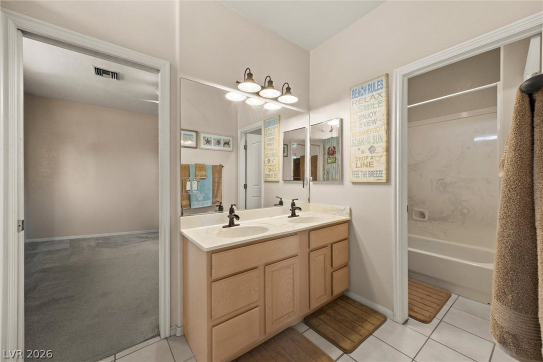 211 W Highland Drive, Henderson, NV 89015 Jack n jill bath with tub/shower combo and dual sinks.