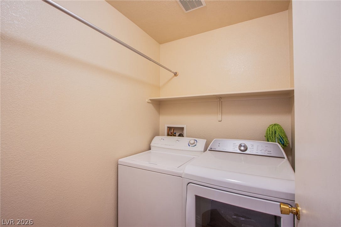 6717 Lookout Lodge Lane, #1, North Las Vegas, NV 89084 A dedicated laundry closet includes built-in shelving and an overhead hanging rod.