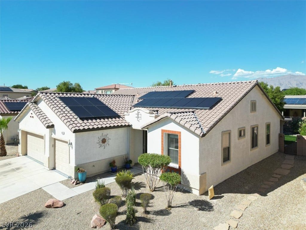Ranch architecture meets eco-friendly design under desert skies.