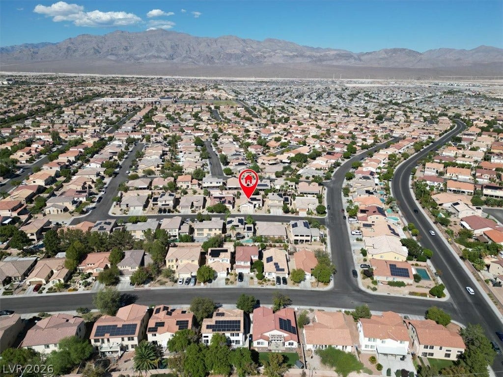Rugged mountains create a dramatic backdrop for this established suburban neighborhood.