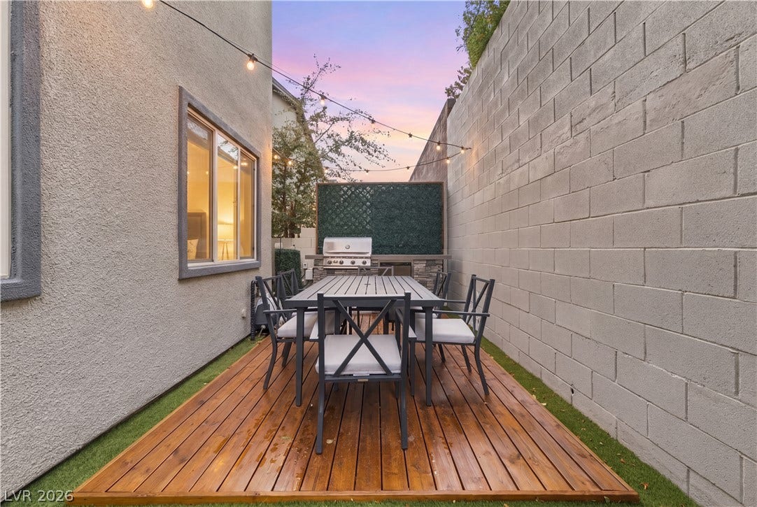 544 Front Range Lane, North Las Vegas, NV 89084 Warm wood decking accents this private outdoor space flanked by stucco and block walls.