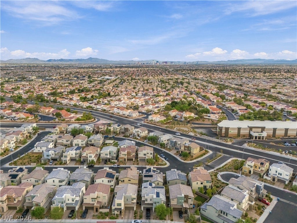544 Front Range Lane, North Las Vegas, NV 89084 Distant city skyline views accent this sweeping aerial perspective of the residential neighborhood.