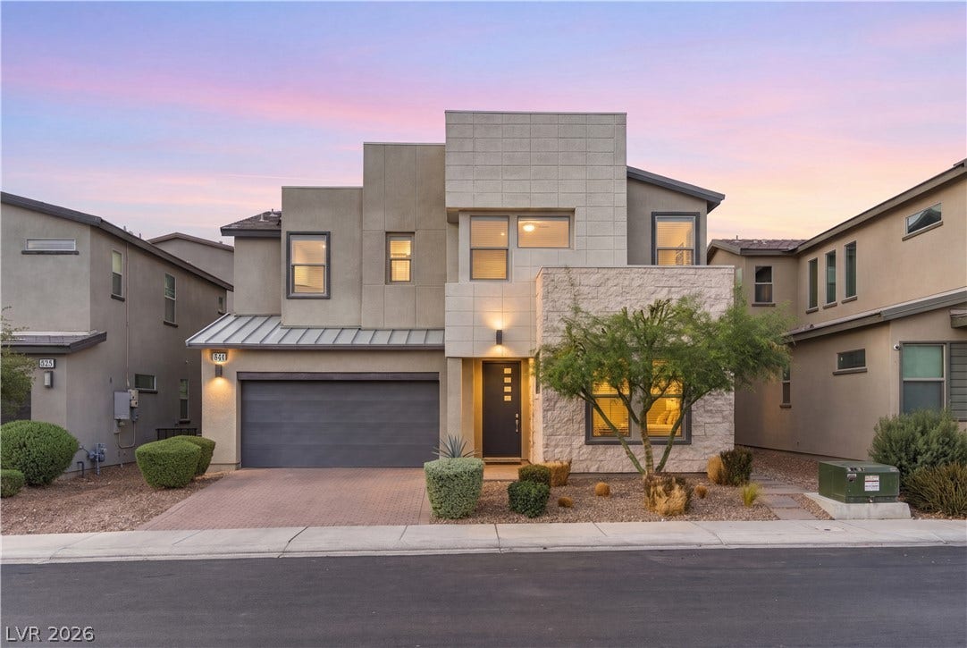544 Front Range Lane, North Las Vegas, NV 89084 Striking contemporary lines and stone accents define this modern multi-level residence at twilight.