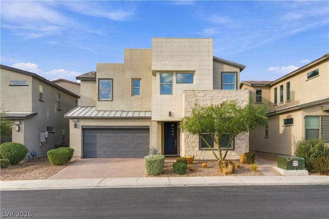 544 Front Range Lane, North Las Vegas, NV 89084 Geometric modern architecture combines with stone accents to create striking curb appeal.