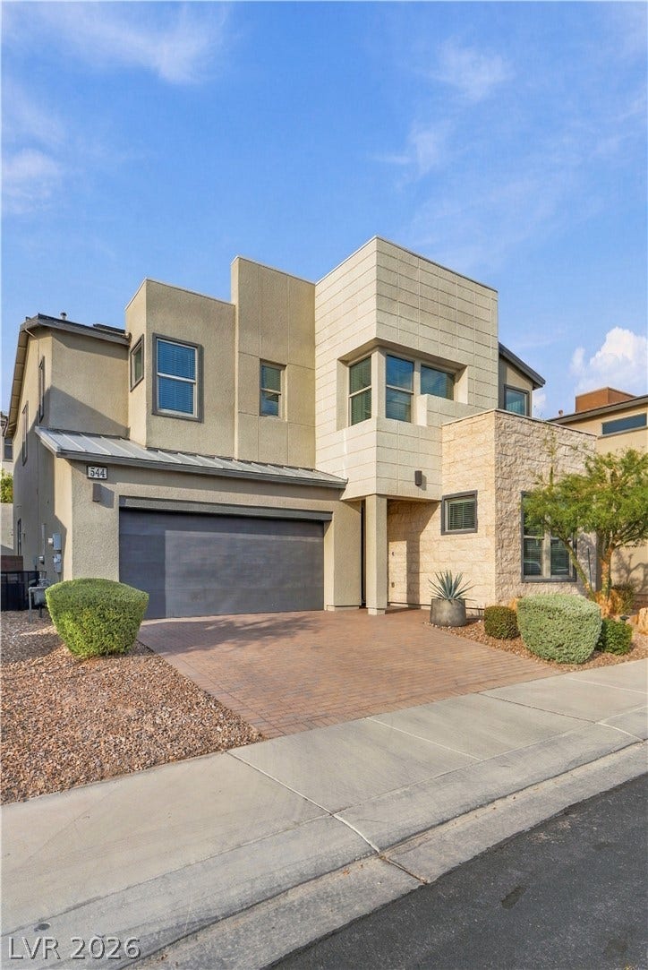 544 Front Range Lane, North Las Vegas, NV 89084 Clean lines and a striking stone facade define this multi-level contemporary home.