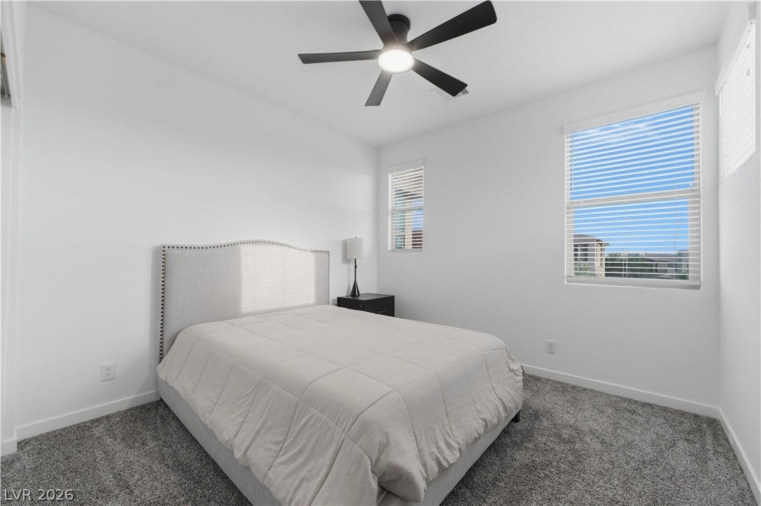 544 Front Range Lane, North Las Vegas, NV 89084 Plush carpeting and abundant natural light create a welcoming and comfortable retreat.
