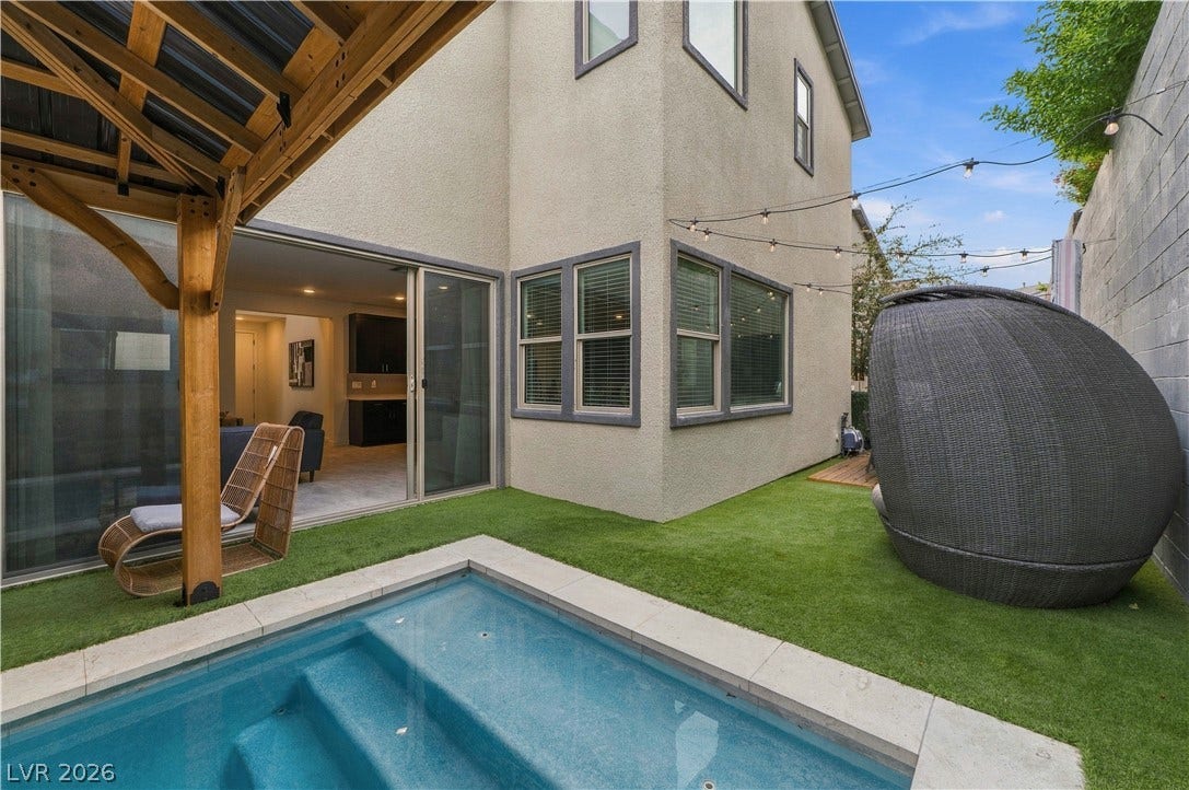 544 Front Range Lane, North Las Vegas, NV 89084 An inviting plunge pool anchors this private backyard retreat alongside modern stucco architecture.