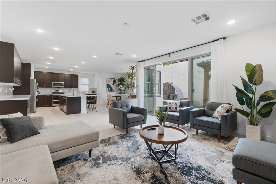 544 Front Range Lane, North Las Vegas, NV 89084 An open floor plan seamlessly connects the main living space to the adjacent kitchen.