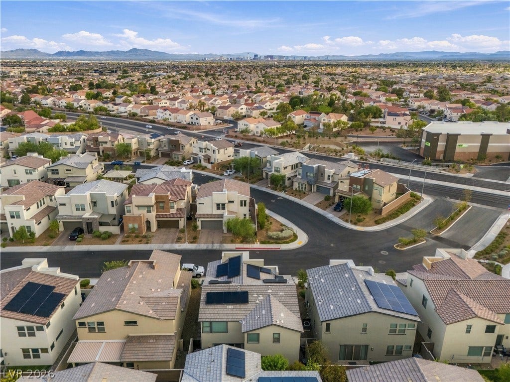 544 Front Range Lane, North Las Vegas, NV 89084 Distant city skyline views and rolling mountain horizons frame this quiet suburban neighborhood.