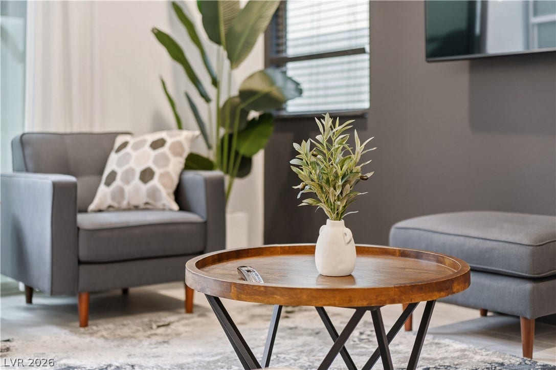 544 Front Range Lane, North Las Vegas, NV 89084 A modern living space features large windows letting in natural light.