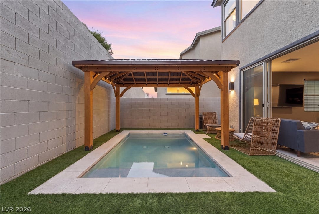 544 Front Range Lane, North Las Vegas, NV 89084 A wooden pavilion shades the inground pool nestled within this private backyard retreat.