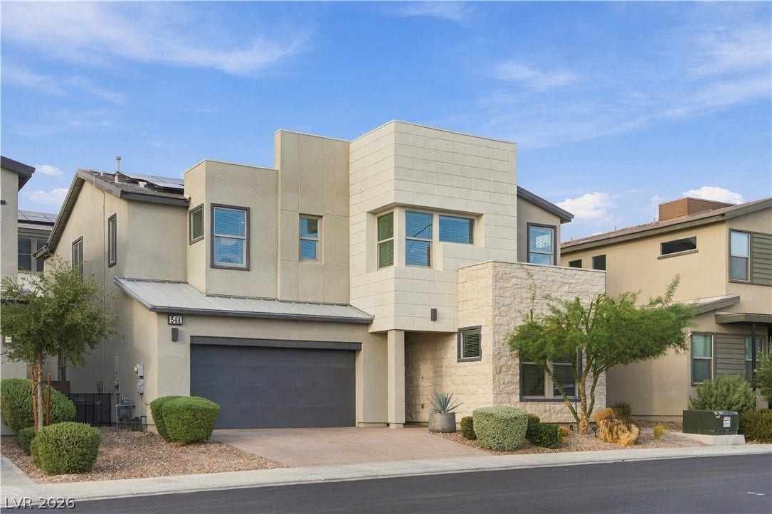 544 Front Range Lane, North Las Vegas, NV 89084 Bold contemporary lines and striking stone accents define this modern two-story exterior facade.