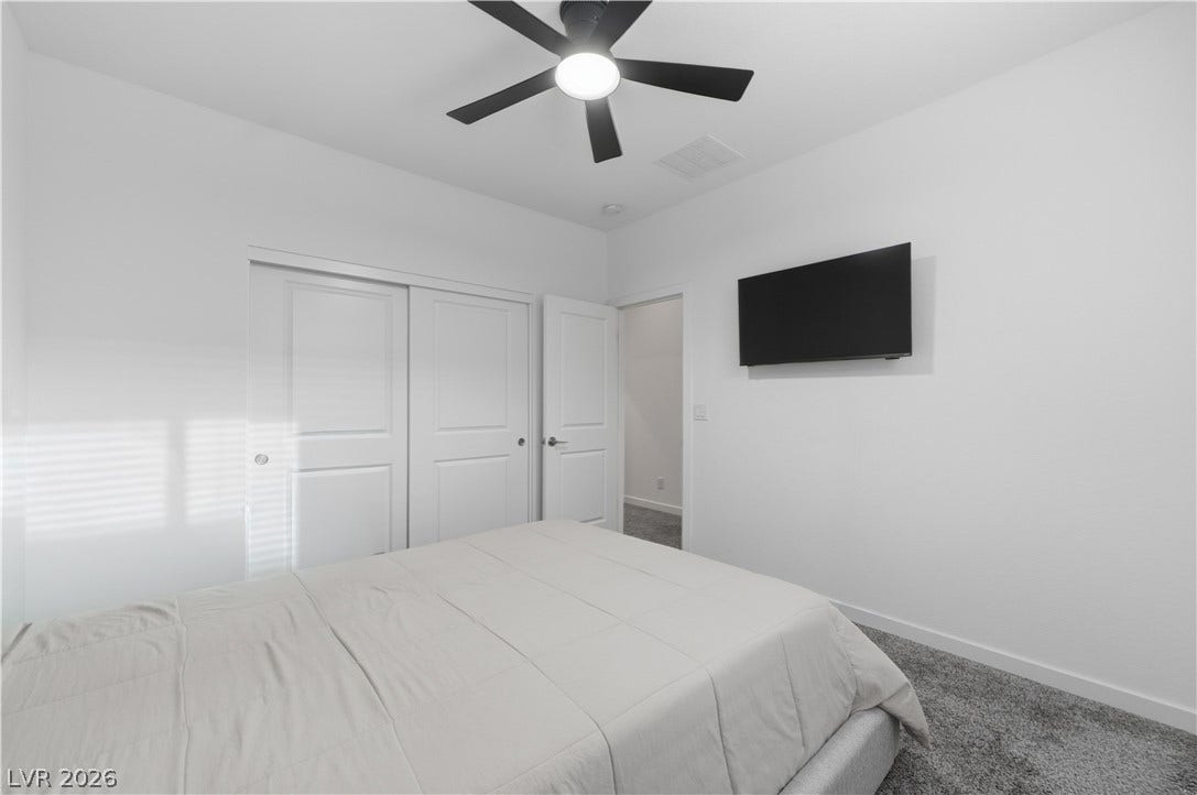 544 Front Range Lane, North Las Vegas, NV 89084 Plush carpeting anchors this clean-lined bedroom.