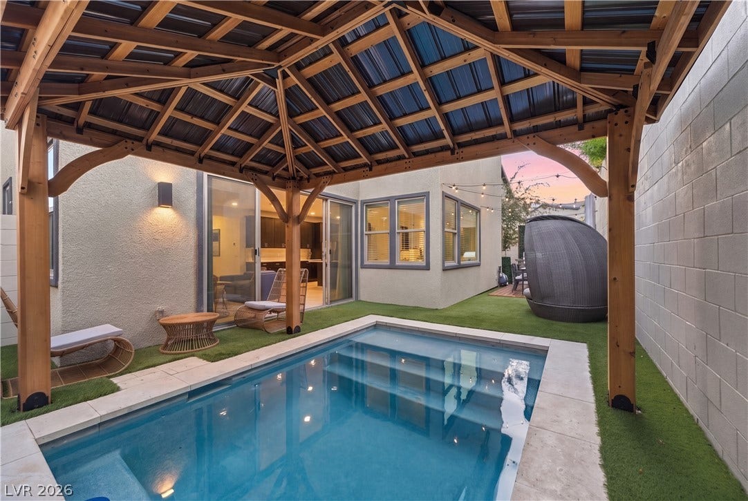 544 Front Range Lane, North Las Vegas, NV 89084 A sparkling plunge pool rests beneath a wooden gazebo in this private backyard oasis.