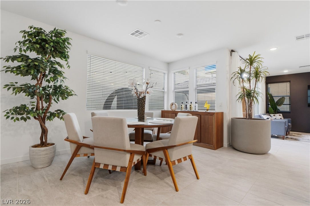 544 Front Range Lane, North Las Vegas, NV 89084 Gleaming tile floors and natural light from several windows enhance this dining area.