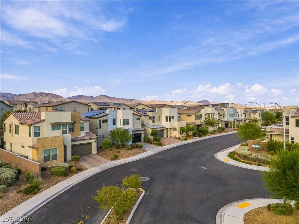 544 Front Range Lane, North Las Vegas, NV 89084 Modern architecture lines this peaceful neighborhood street framed by distant mountain views.