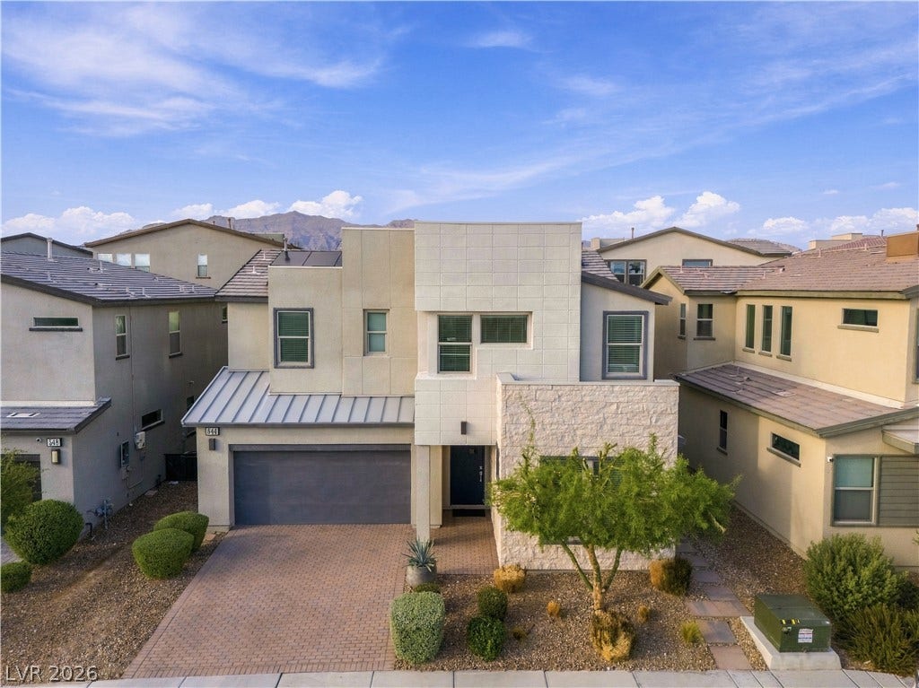 544 Front Range Lane, North Las Vegas, NV 89084 Striking contemporary lines and stone accents define this modern two-story exterior design.