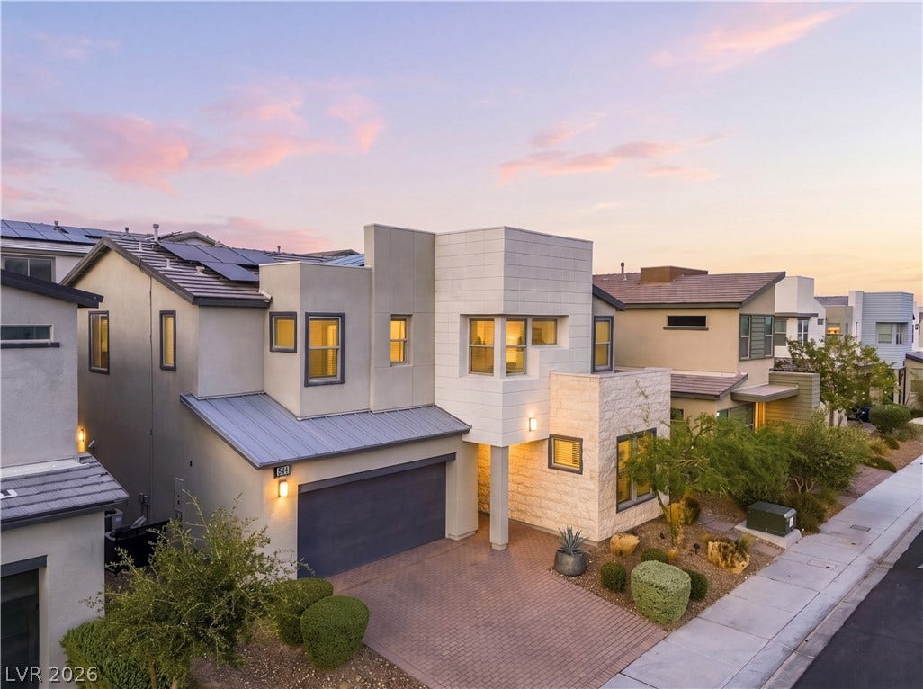 544 Front Range Lane, North Las Vegas, NV 89084 Striking contemporary architecture showcases clean geometric lines and a textured stone facade.