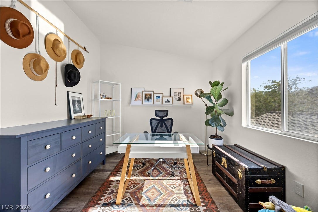 1421 Dragon Rock Drive, Henderson, NV 89052 Vaulted ceilings and wide windows define this versatile home workspace.
