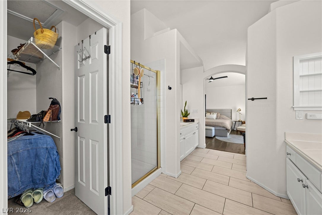 1421 Dragon Rock Drive, Henderson, NV 89052 A spacious layout connects the primary bath and walk-in closet to the bedroom.