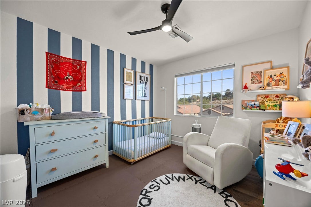 1421 Dragon Rock Drive, Henderson, NV 89052 Multi-pane windows draw natural light into this charming room finished with durable flooring.