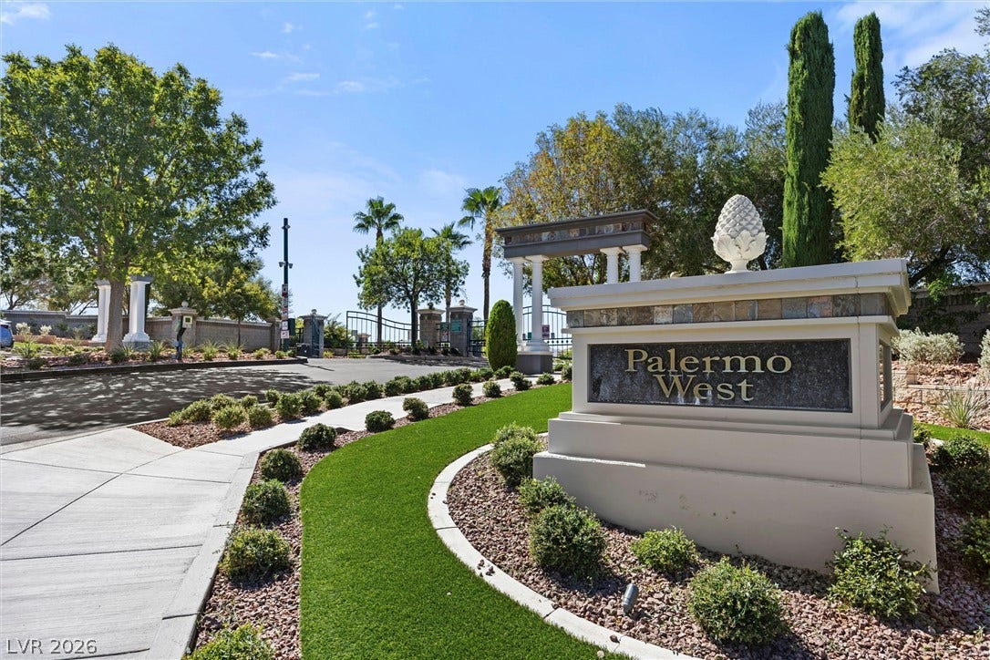 1421 Dragon Rock Drive, Henderson, NV 89052 Manicured landscaping surrounds the entry monument of this gated residential community.