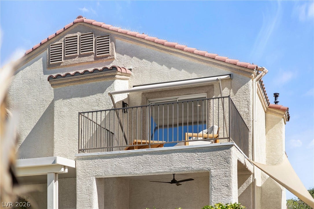 1421 Dragon Rock Drive, Henderson, NV 89052 Stucco exterior walls and a tile roof define the timeless architecture of this residence.