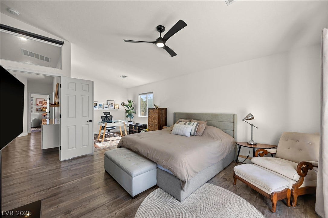 1421 Dragon Rock Drive, Henderson, NV 89052 Rich wood floors lay a beautiful foundation beneath soaring vaulted ceilings in this serene retreat.